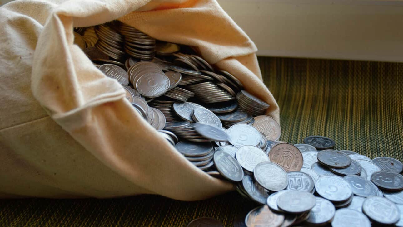 A bag of silver coins showing will silver hit $100 an ounce