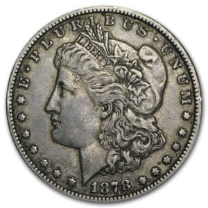An 1878 Morgan Silver Dollar graded as extremely fine shows only faint signs of wear and tear.]