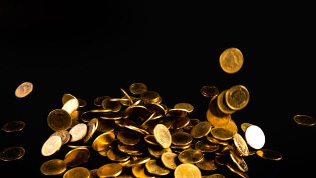 An image of gold coins showing physical gold coins as money.