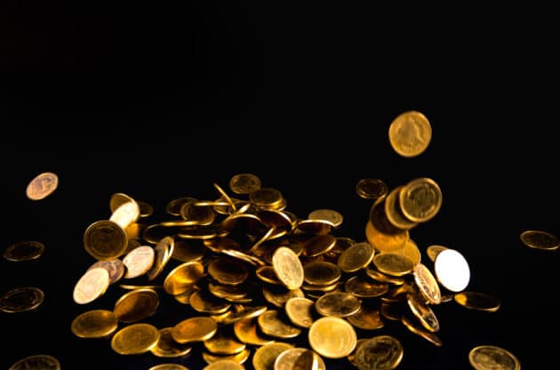 An image of gold coins showing physical gold coins as money.