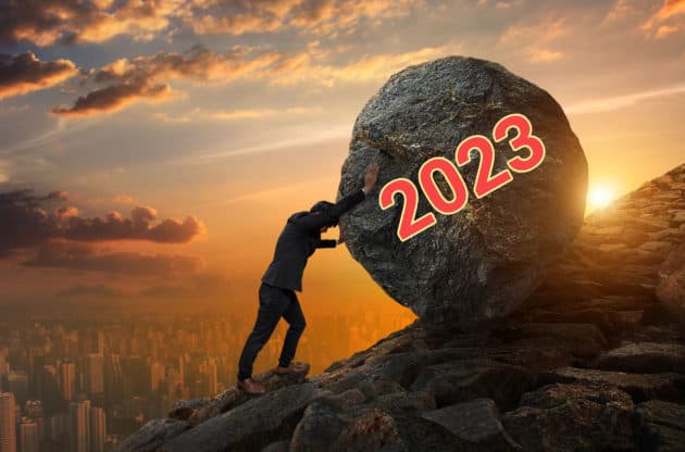 Sisyphus pushing a boulder up the hill to symbolize the challenges facing the economy in 2023.