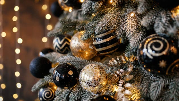 An image of gold and silver Christmas ornaments.